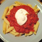 Homemade Bolognese Sauce with Penne Pasta and Sour Cream